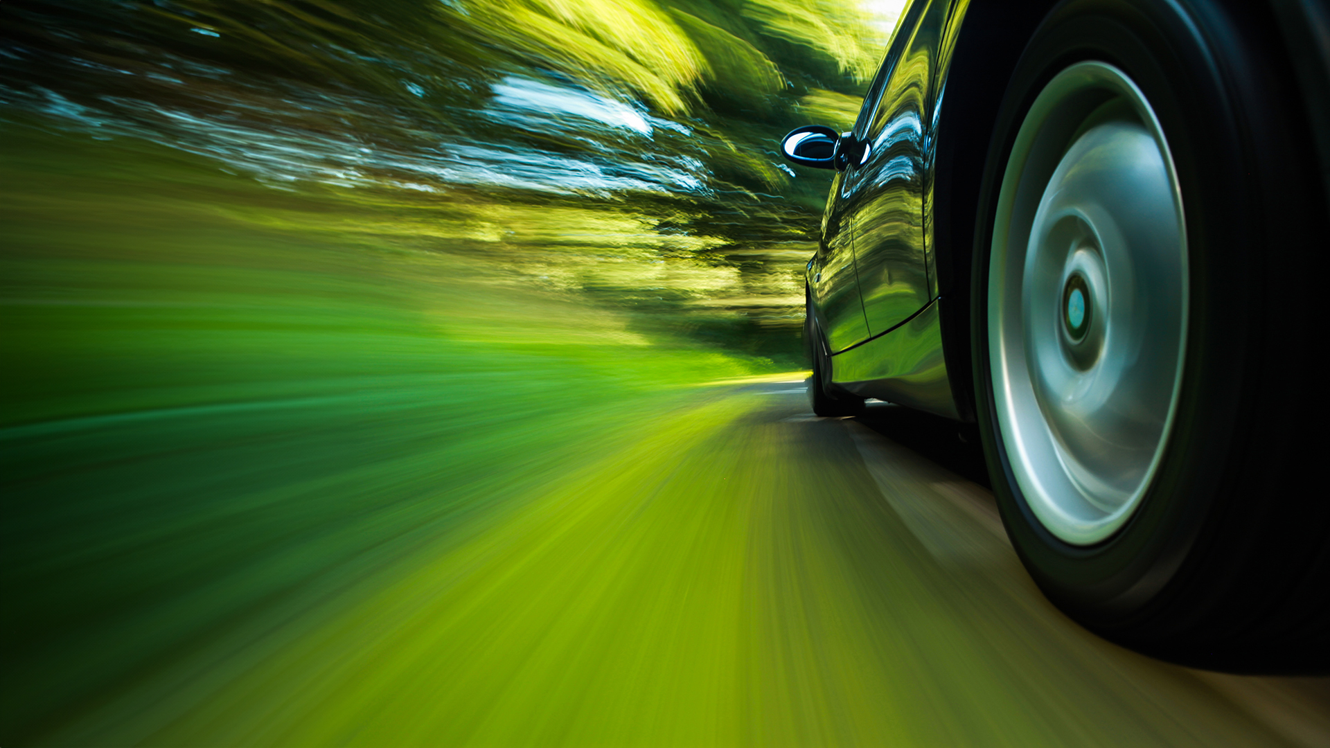 Rear side view of sport car with heavy blurred motion. DKarbo Show